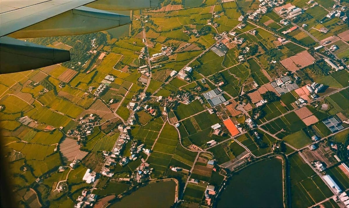 view of a rural area from the window of a plane.