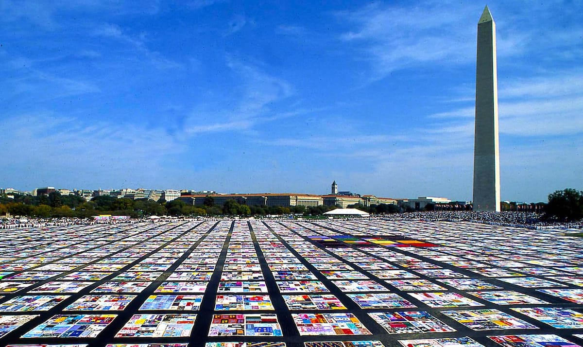an aerial view of the AIDS memorial quilt on the national mall.