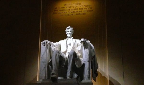 marble statue of abraham lincoln from the lincoln memorial.