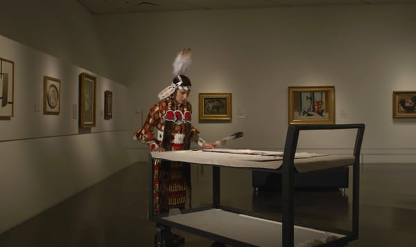 a video by Jeffrey Gibson called 'one becomes the other'. the film is set in the Denver Art Museum. Indigenous people in cere