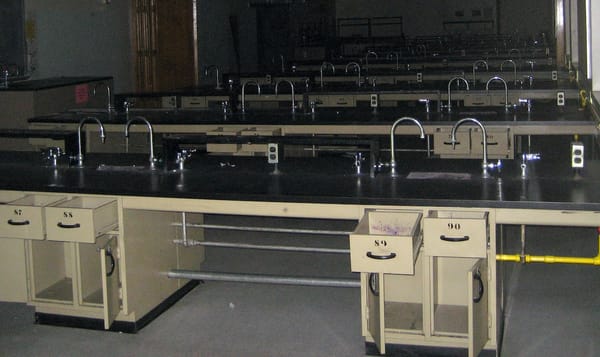 rows of lab benches in an abandoned classroom