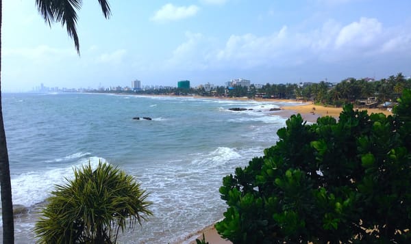 a beach on the coast of Colombo, Sri Lanka on a windy day.