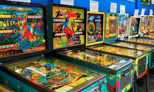 a row of antique pinball machines