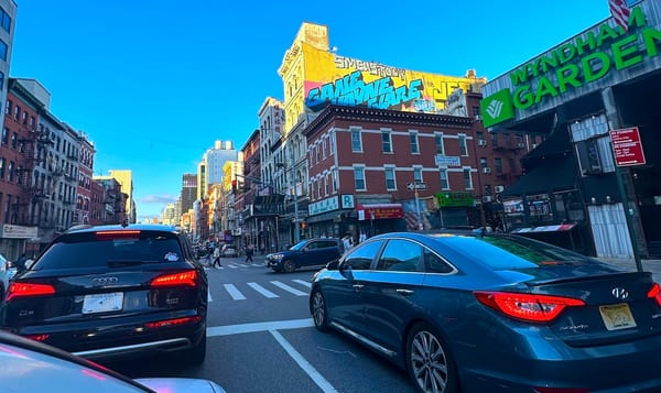 traffic waiting at a busy city intersection