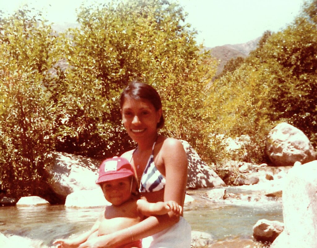 another photo of me as a baby sitting in the river with my mom.