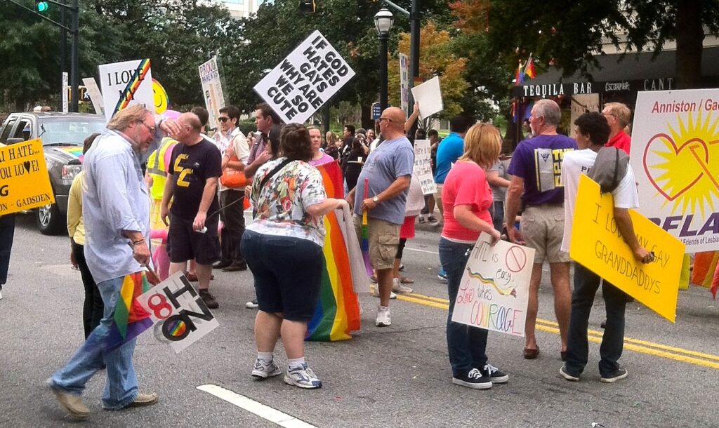 a group of people marching in a pride parade