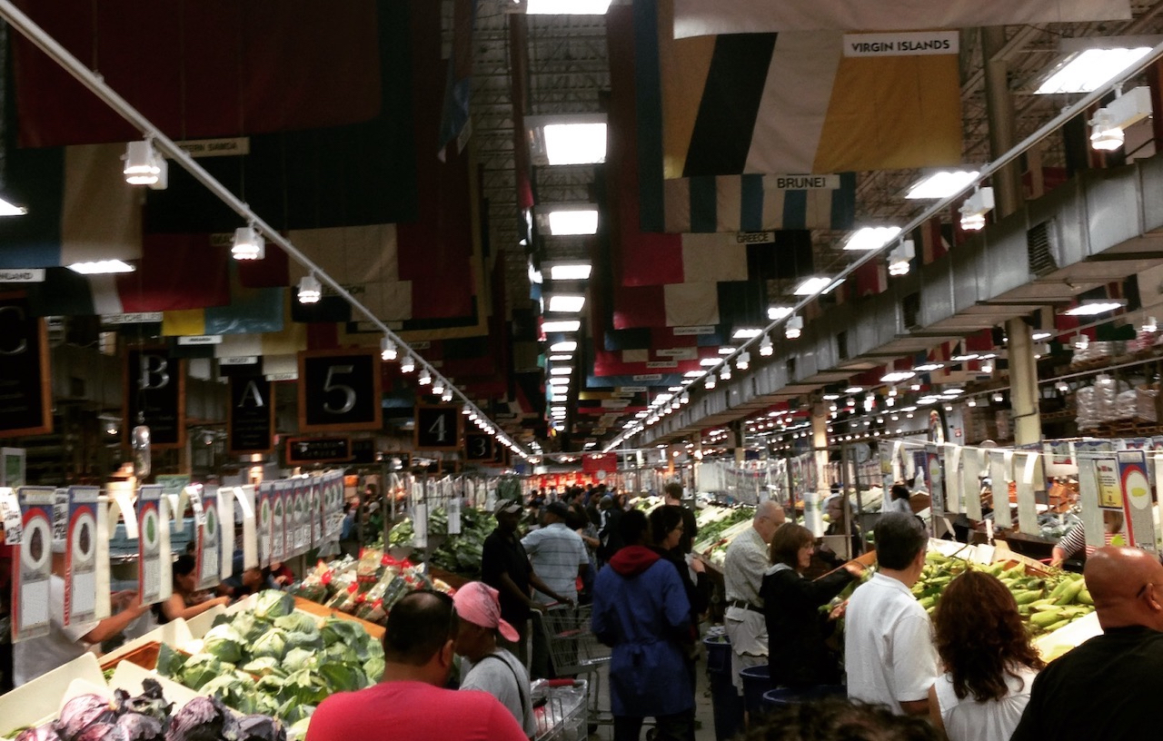 customers shopping for produce in a large store