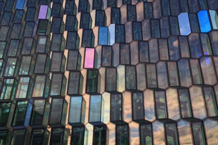a closeup photo of Harpa, a performing arts center in Reykjavic with a honeycomb-like window design